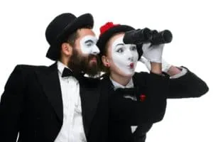 Two memes as business people looking through binoculars