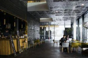 Businessmen sitting at tables in restaurant